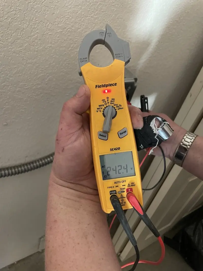 Voltage testing with clamp meter during Whole House Surge Protector in Batavia